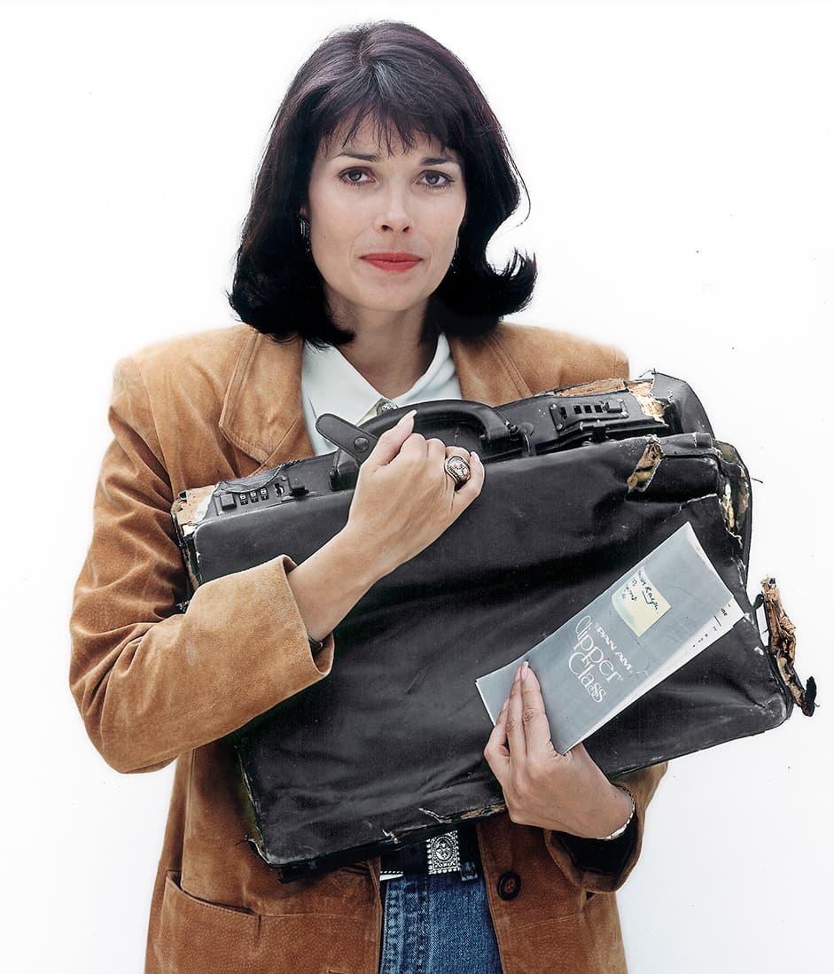 Victoria Cummock holding John Cummock's attache