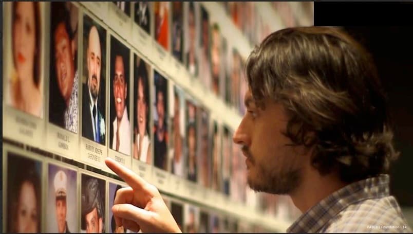Visitor at 911 Memorial and Museum Wall of Faces